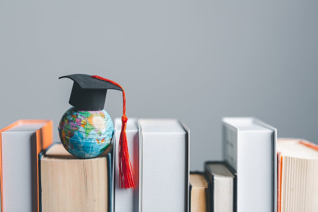 Graduation cap with Earth globe. Concept of global business study, abroad educational, Back to School. Education in Global world, Study abroad business in universities in worldwide. language study