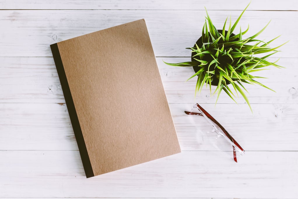 Note book on wooden background